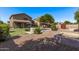 A verdant backyard featuring a pool, patio and green space at 1405 E Aloe Dr, Chandler, AZ 85286