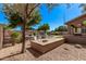Private backyard featuring gravel landscaping, built-in seating area and a view of the sparkling pool at 1405 E Aloe Dr, Chandler, AZ 85286