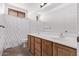 Bathroom with dual sinks, shower, and neutral tile flooring at 1405 E Aloe Dr, Chandler, AZ 85286