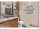 A bathroom vanity with framed mirror and decor at 1405 E Aloe Dr, Chandler, AZ 85286