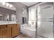 Cozy bathroom with bathtub, a glass enclosed shower, and vanity with light fixtures at 1405 E Aloe Dr, Chandler, AZ 85286