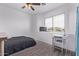 Bedroom with desk, a ceiling fan, and natural light from the window at 1405 E Aloe Dr, Chandler, AZ 85286
