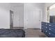 Bedroom with a closet, neutral gray flooring, and large window at 1405 E Aloe Dr, Chandler, AZ 85286