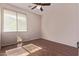 A sun-filled bedroom with a window and ceiling fan at 1405 E Aloe Dr, Chandler, AZ 85286