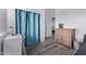 Bedroom with a desk, blue accents, and natural light from the window at 1405 E Aloe Dr, Chandler, AZ 85286