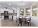Eat-in kitchen and dining area, lots of natural light, and views of the backyard at 1405 E Aloe Dr, Chandler, AZ 85286