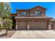 Charming two-story home with a three-car garage, landscaped front yard, and a tile roof at 1405 E Aloe Dr, Chandler, AZ 85286