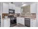 Bright kitchen features stainless steel appliances, granite countertops, and tiled backsplash at 1405 E Aloe Dr, Chandler, AZ 85286