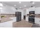 Spacious kitchen showcases white cabinetry, stainless appliances, and a tile backsplash at 1405 E Aloe Dr, Chandler, AZ 85286