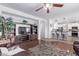 Cozy living room features hardwood floors, built-in shelving, and an open floor plan leading to the kitchen at 1405 E Aloe Dr, Chandler, AZ 85286