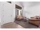 Bright living room featuring high ceilings, a large window, neutral colors, and comfortable seating at 1405 E Aloe Dr, Chandler, AZ 85286