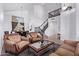 Open-concept living area with staircase, dining area, high ceilings, and a view to upstairs at 1405 E Aloe Dr, Chandler, AZ 85286