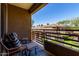 Balcony featuring two chairs and a scenic view of the neighborhood at 1411 E Orangewood Ave # 233, Phoenix, AZ 85020