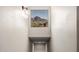 The hallway features a light fixture and framed view of mountains at 1411 E Orangewood Ave # 233, Phoenix, AZ 85020