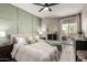Inviting main bedroom featuring a large window, balcony access and stylish decor at 1411 E Orangewood Ave # 233, Phoenix, AZ 85020