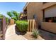 Paver walkway with mature shrubs leads into this well-maintained community at 1411 E Orangewood Ave # 233, Phoenix, AZ 85020
