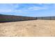 The backyard features a cinder block perimeter and spacious lot at 15389 W Cottontail Ln, Surprise, AZ 85387