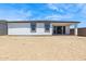 Exterior of home featuring a flat backyard, patio, and block wall perimeter at 15389 W Cottontail Ln, Surprise, AZ 85387