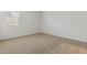 Bedroom featuring neutral carpet, a window, and neutral paint at 15389 W Cottontail Ln, Surprise, AZ 85387