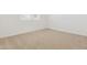 Neutral bedroom with a carpeted floor and natural light from the window at 15389 W Cottontail Ln, Surprise, AZ 85387