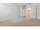 Bedroom features neutral carpet and a closet with an open door at 15389 W Cottontail Ln, Surprise, AZ 85387