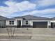 Charming single-story home with a well-maintained yard and a two-car garage at 15389 W Cottontail Ln, Surprise, AZ 85387