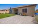 Spacious backyard with a patio and lawn area, ideal for relaxing and entertaining, complements the beautiful home exterior at 15862 W Fillmore St, Goodyear, AZ 85338