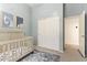 This light blue Bedroom features a crib and a double door closet at 15862 W Fillmore St, Goodyear, AZ 85338