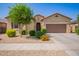 Charming single-story home featuring a well-kept front yard and a two-car garage, offering a welcoming and appealing exterior at 15862 W Fillmore St, Goodyear, AZ 85338