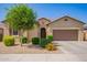 Welcoming single-story home with a two-car garage and drought-tolerant landscaping at 15862 W Fillmore St, Goodyear, AZ 85338