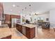 Open-concept kitchen flows into the living area with large island and stainless appliances at 15862 W Fillmore St, Goodyear, AZ 85338