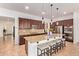 Gourmet kitchen with a large island, granite countertops, and stainless steel appliances at 15862 W Fillmore St, Goodyear, AZ 85338