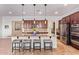 Well-appointed kitchen featuring a central island with bar seating and stainless appliances at 15862 W Fillmore St, Goodyear, AZ 85338
