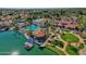 Stunning aerial view of the community center showcasing a pool, lake access, and lush landscaping at 1633 E Lakeside Dr # 127, Gilbert, AZ 85234