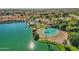 Breathtaking aerial view of the waterfront community with a lagoon-style beach and lush landscaping at 1633 E Lakeside Dr # 127, Gilbert, AZ 85234