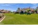 Expansive community green space offering a serene view of well-maintained homes and landscaping at 1633 E Lakeside Dr # 127, Gilbert, AZ 85234