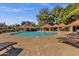 Resort-style community pool area with covered seating and ample lounge chairs for residents at 1633 E Lakeside Dr # 127, Gilbert, AZ 85234
