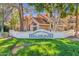 Inviting Beach Club Village community sign with lush green grass and well-maintained landscaping at 1633 E Lakeside Dr # 127, Gilbert, AZ 85234