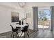 Chic dining area with modern lighting, round table, and outdoor access at 1633 E Lakeside Dr # 127, Gilbert, AZ 85234