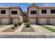 Townhouse exterior with a garage and neat landscaping at 1633 E Lakeside Dr # 127, Gilbert, AZ 85234