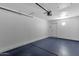 Empty garage interior with automatic door opener and white walls at 1633 E Lakeside Dr # 127, Gilbert, AZ 85234