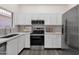 Well-lit kitchen with stainless steel appliances and modern white cabinetry at 1633 E Lakeside Dr # 127, Gilbert, AZ 85234