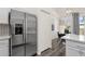 Kitchen featuring stainless steel refrigerator and a view into the dining area at 1633 E Lakeside Dr # 127, Gilbert, AZ 85234