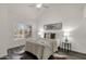 Serene primary bedroom with soft lighting, a cozy bed, and bright windows at 1633 E Lakeside Dr # 127, Gilbert, AZ 85234