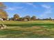 A neighborhood park with a shady playground and grassy fields near a residential area at 1633 E Lakeside Dr # 127, Gilbert, AZ 85234