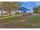 A neighborhood park with a shady playground near residential streets at 1633 E Lakeside Dr # 127, Gilbert, AZ 85234