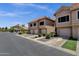 Street view of townhouses with tile roofs and tidy landscaping at 1633 E Lakeside Dr # 127, Gilbert, AZ 85234