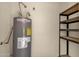 Water heater and storage shelves in the utility room at 1633 E Lakeside Dr # 127, Gilbert, AZ 85234