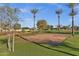 Community volleyball court with palm trees and open green space is a great place for outdoor recreation at 1633 E Lakeside Dr # 127, Gilbert, AZ 85234