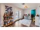 Versatile flex room with stylish bar cart, backyard access, and storage options at 1718 W Voltaire Ave, Phoenix, AZ 85029